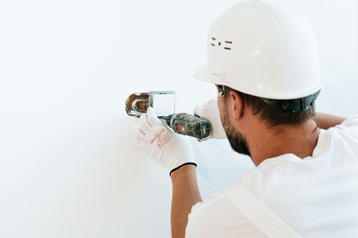 An electrician fitting a socket